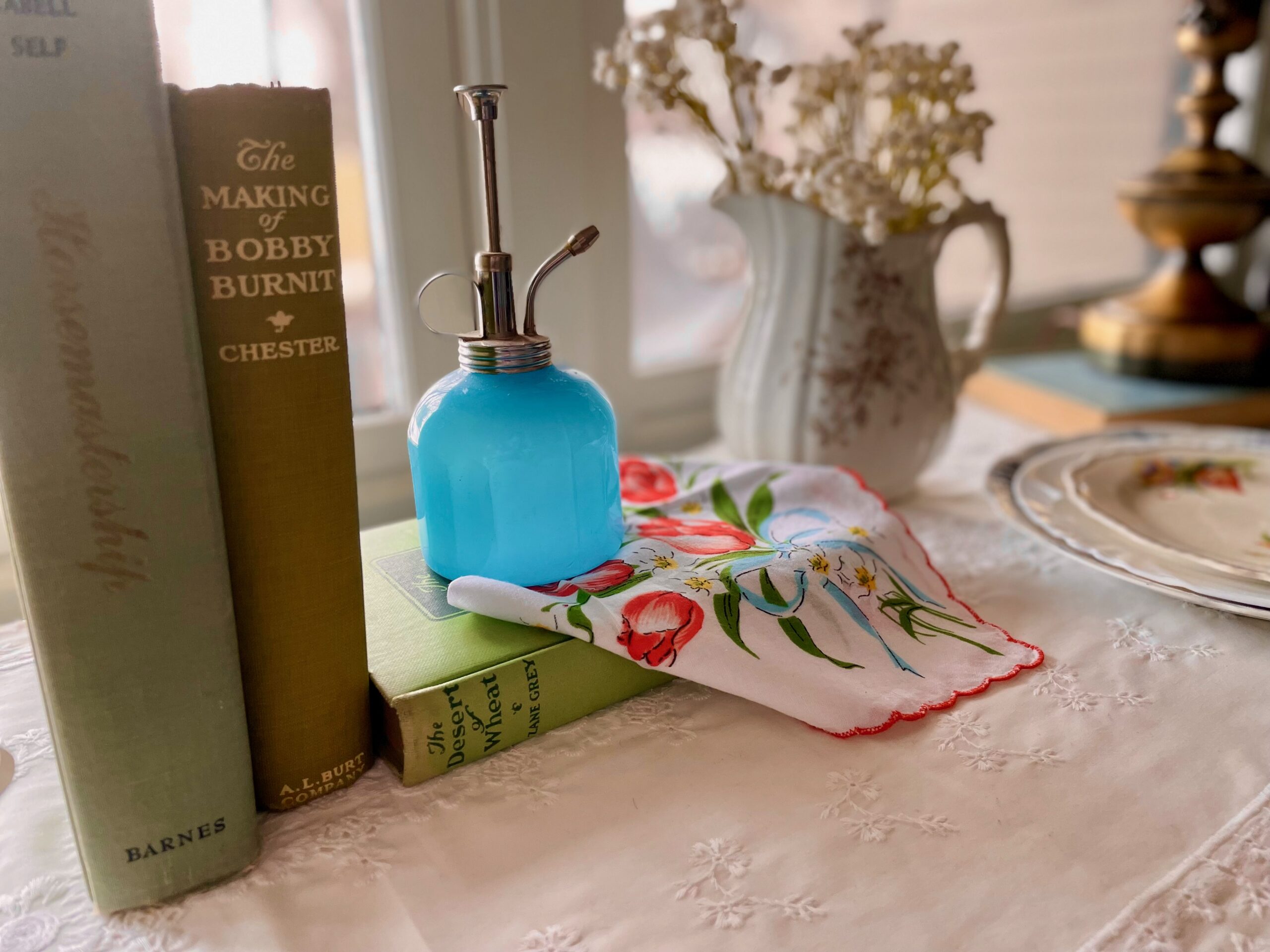 vintage books and decor used in a Spring vignette