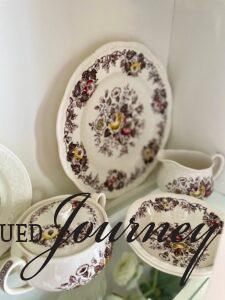 vintage transferware dishes styled in a hutch