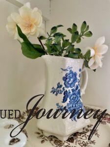 an antique Ironstone blue and white floral vase used in a Spring hutch display