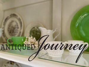 vintage milk glass and jadeite used in a Spring hutch display