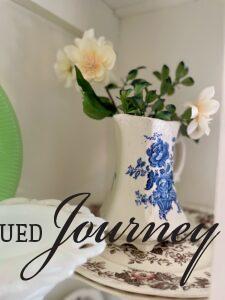 a vintage transferware vase used in a hutch for Spring