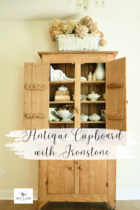 an antique cupboard display with Ironstone from Sky Lark House