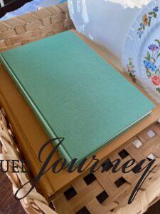 a vintage teal book used in a decorative basket