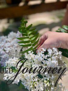 styling a Summer floral arrangement with Lilacs and Ferns