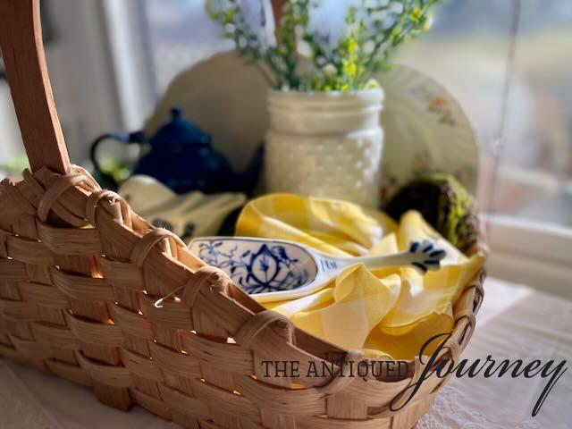 a thrifted basket used to create a Spring basket vignette