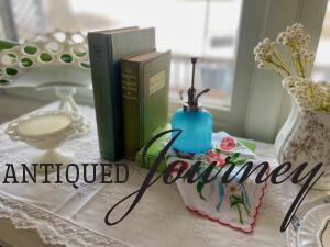 a Spring vignette with vintage decor and a vintage handkerchief
