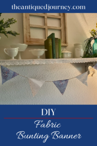 a DIY bunting banner hanging on a shelf