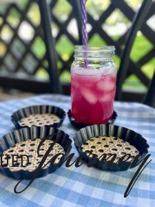 DIY mini tart pan coasters with a glass of lemonade