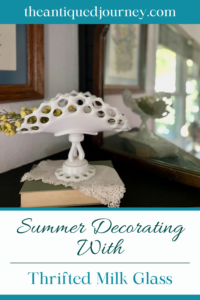 a vintage milk glass banana stand styled on a mantel for Summer