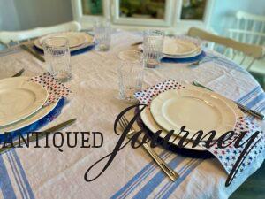 adding flatware and drinking glasses for a 4th of July table