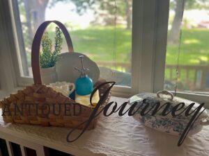 a thrifted basket with milk glass and other vintage decor for Summer