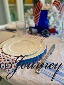 white thrifted plates used for a patriotic tablescape