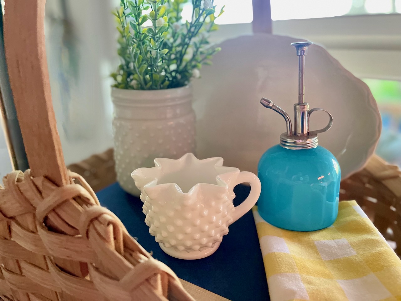 a basket vignette with thrifted Summer decor