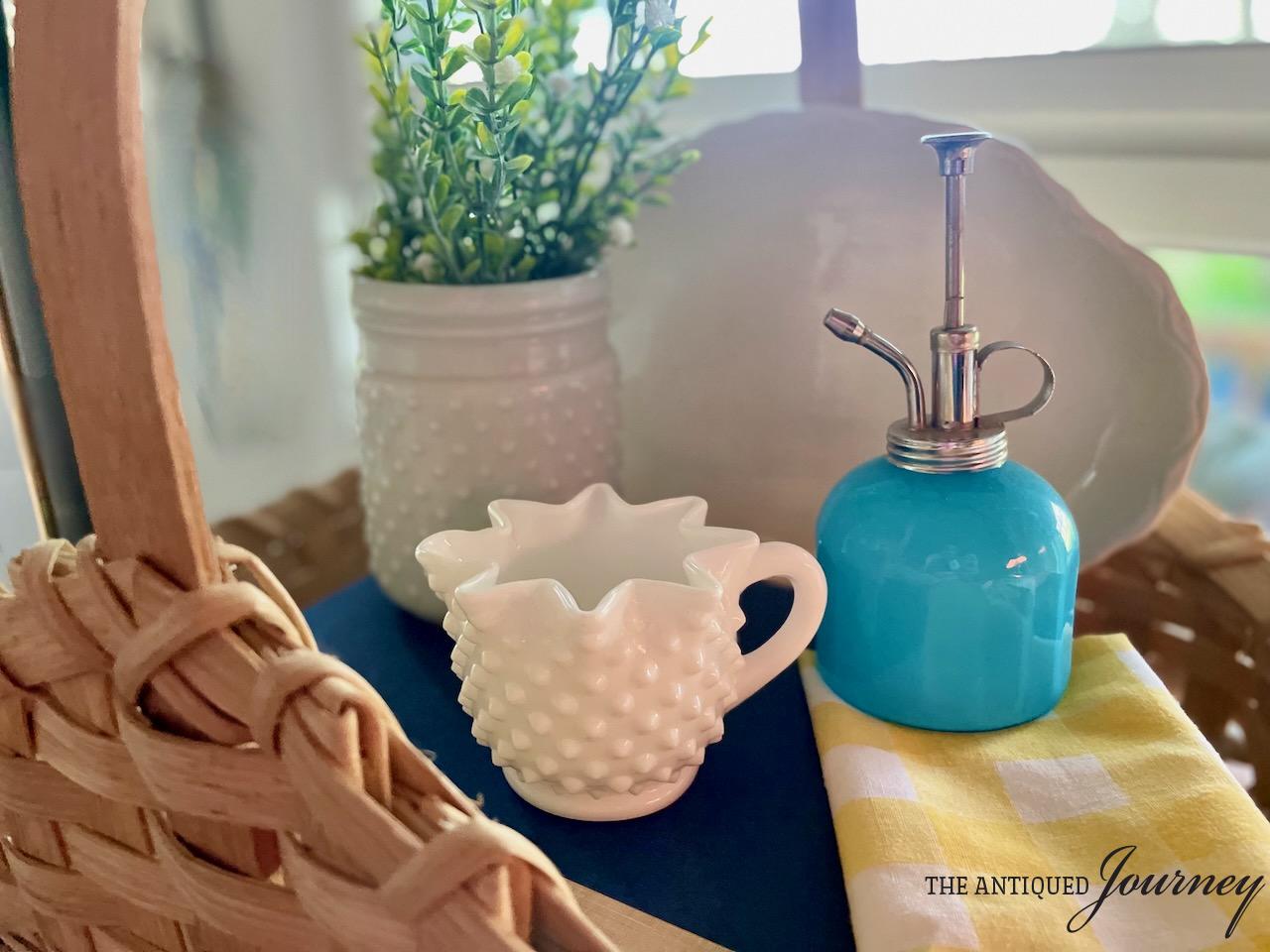 a basket vignette with thrifted Summer decor