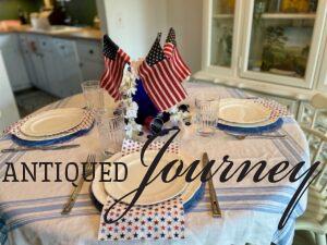 a finished 4th of July table setting and centerpiece