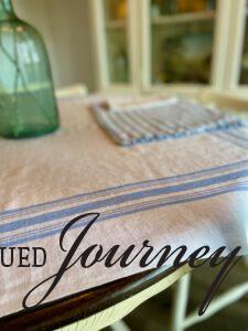 a vintage blue and white striped table linen