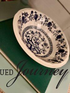 a vintage blue book styled with a vintage bowl