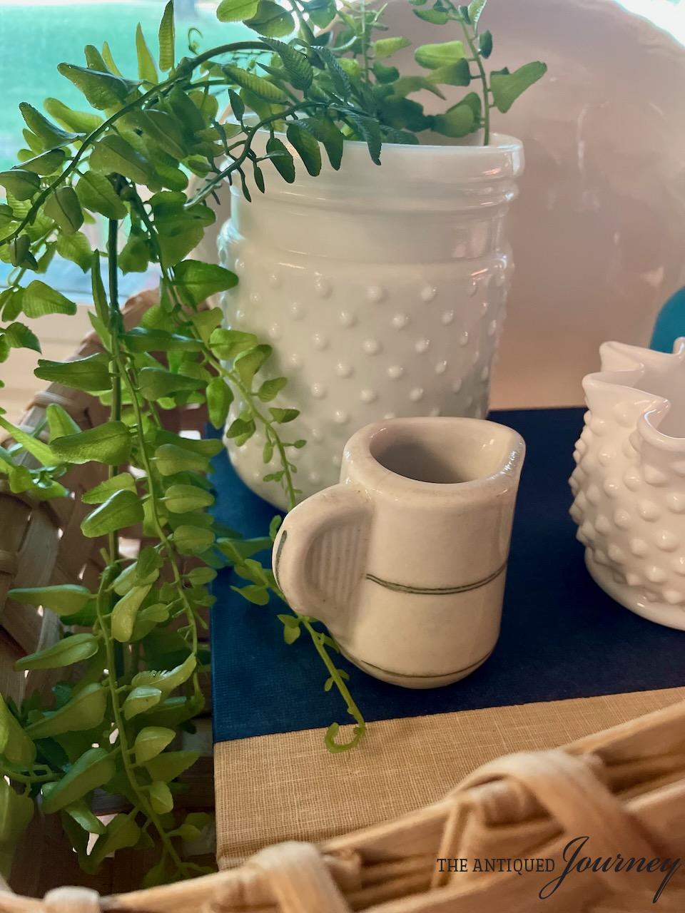vintage decor in a basket for mid-Summer styling