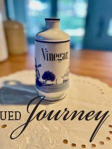 a vintage Vinegar bottle and a vintage linen