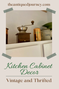 vintage kitchen decor styled above cabinets