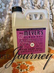 Mrs. Meyers hand soap on a vintage linen