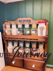 a vintage spice rack with glass jars