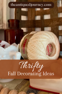 a vintage thread spool with copper and milk glass for Fall