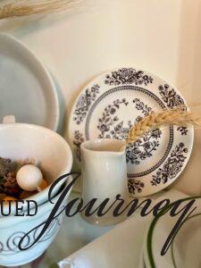 a vintage ironstone creamer with faux wheat for Fall decor