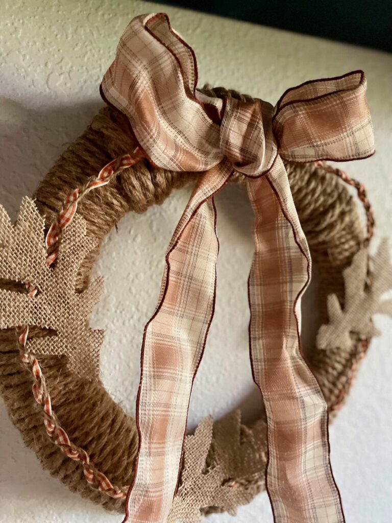 Simple braided rope wreath DIY for Fall with a plaid ribbon