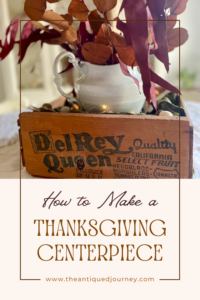 a vintage wooden crate for a Thanksgiving centerpiece