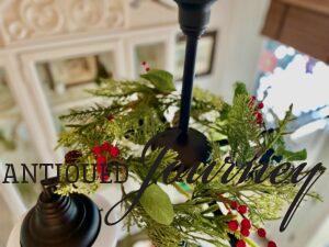 decorating a chandelier for Christmas