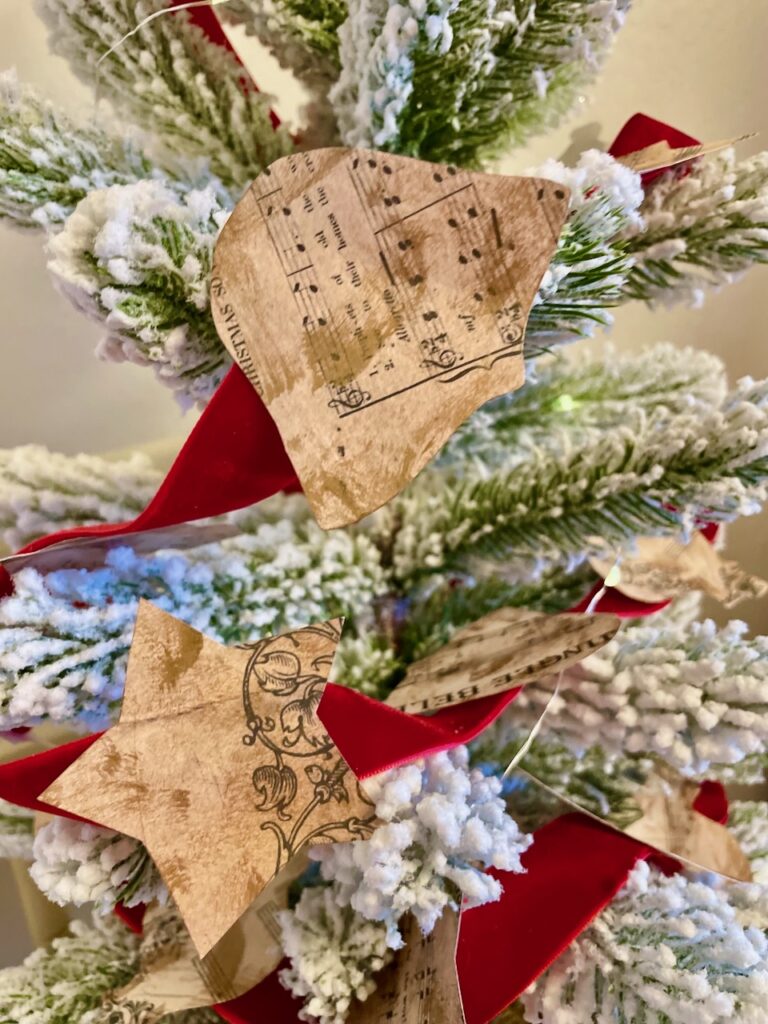 a christmas garland with vintage sheet music