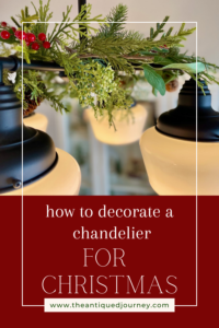 decorating a chandelier for Christmas 