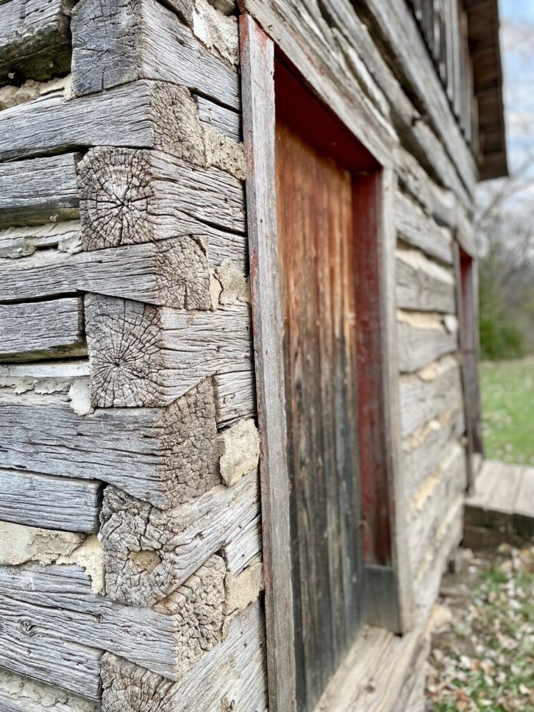 old wood building in the woods