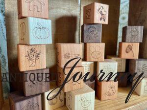 picture images on wooden alphabet blocks