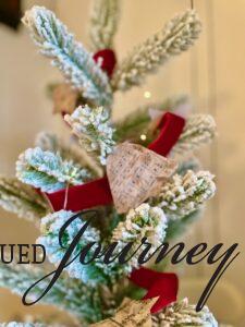 a DIY Christmas garland with vintage Christmas music on a flocked tree