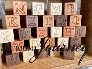 uppercase wooden letter blocks.