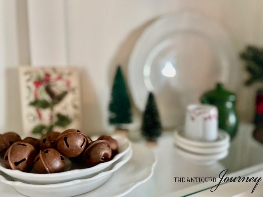 decorating with vintage Christmas items bells and ironstone