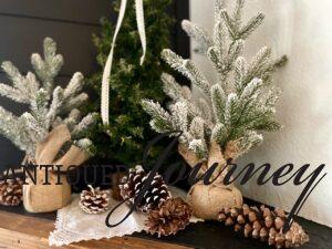 pinecones and green trees on a Winter mantel decor