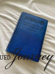 thrifted blue book with French writing