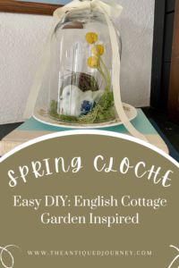 a DIY Spring cloche with moss and a faux bird