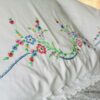 vintage floral throw pillows on the bed
